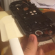 Separating the screen sticker from the PS Vita casing with heat